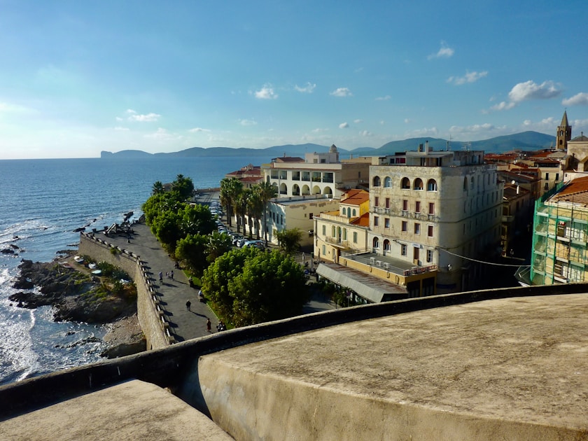 brown concrete building near sea during daytime