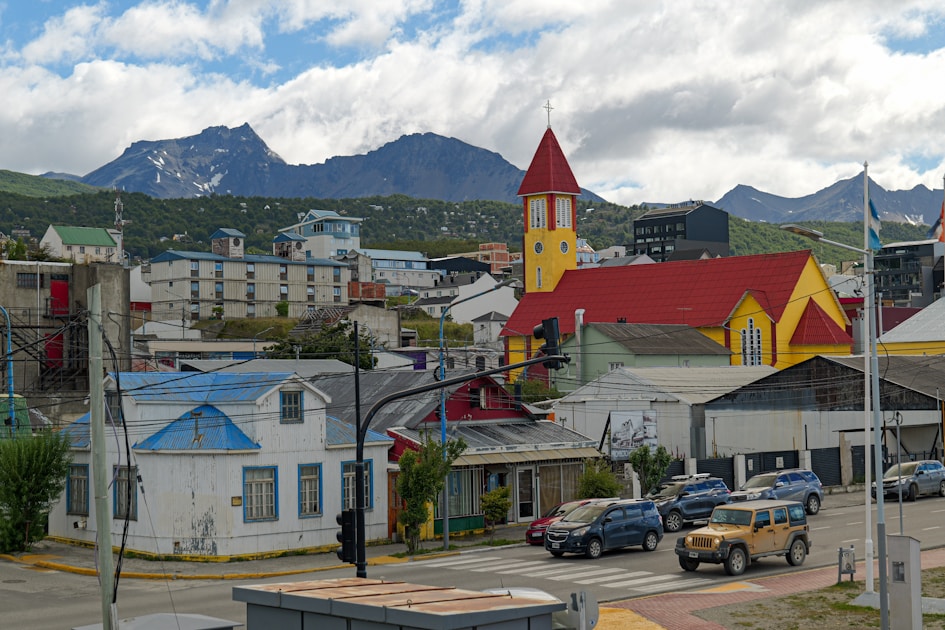 A small town with mountains in the background