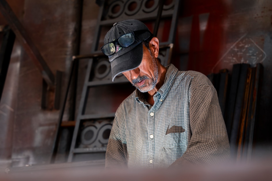 A man is working on a piece of wood