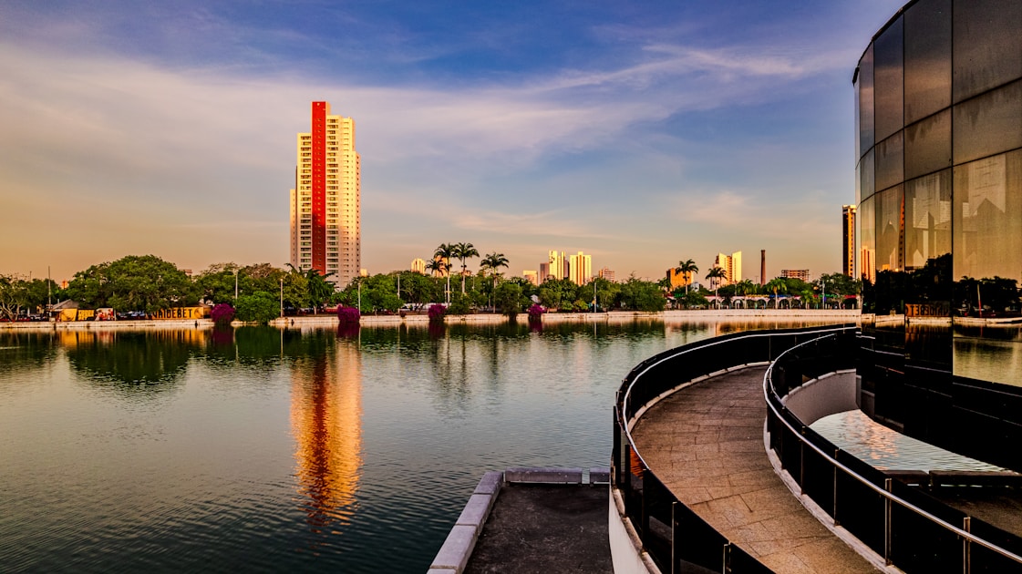 a large body of water next to a tall building