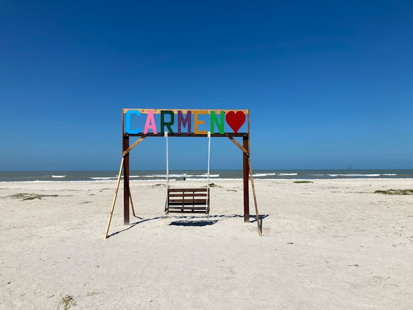 a bench sits on a beach