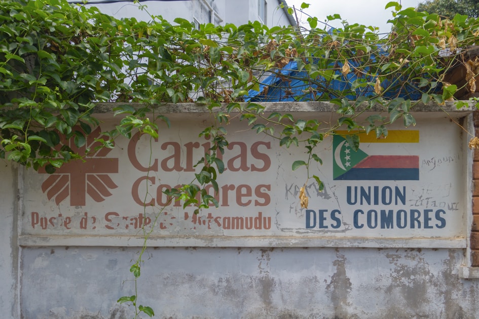 Caritas comores sign with flag and text