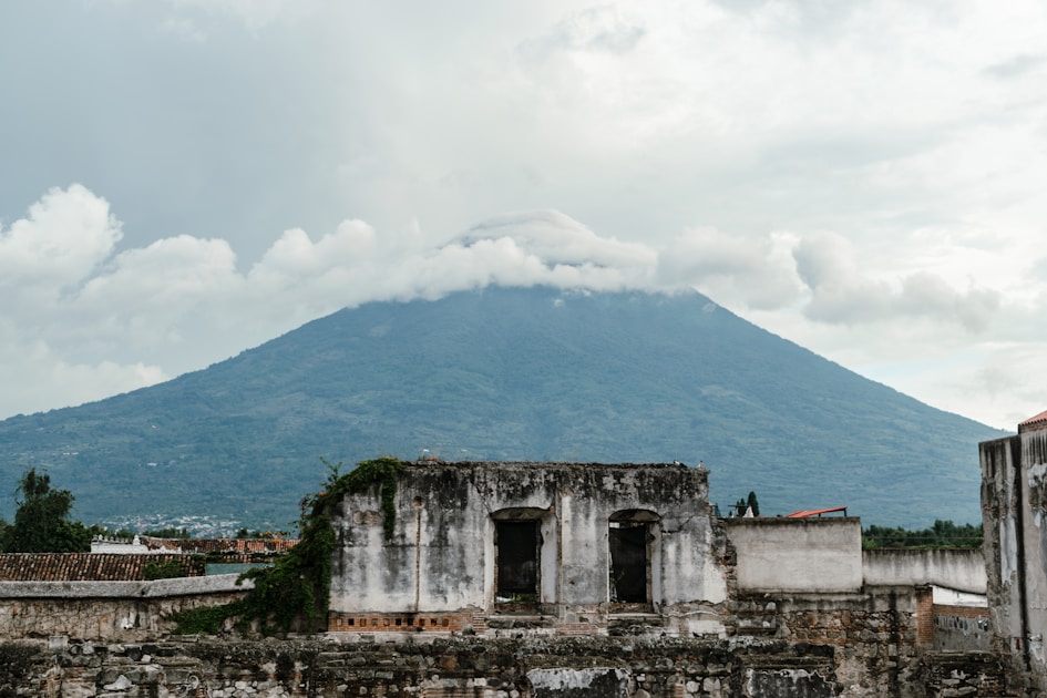 Mountain rises above ancient ruins.