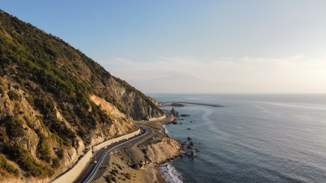 aerial view of a road near the sea during daytime