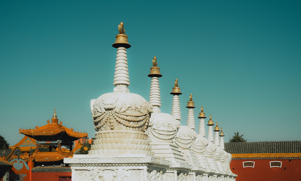 A large white building with a golden roof