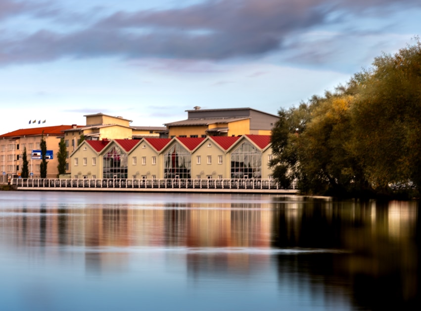 A large body of water with buildings in the background