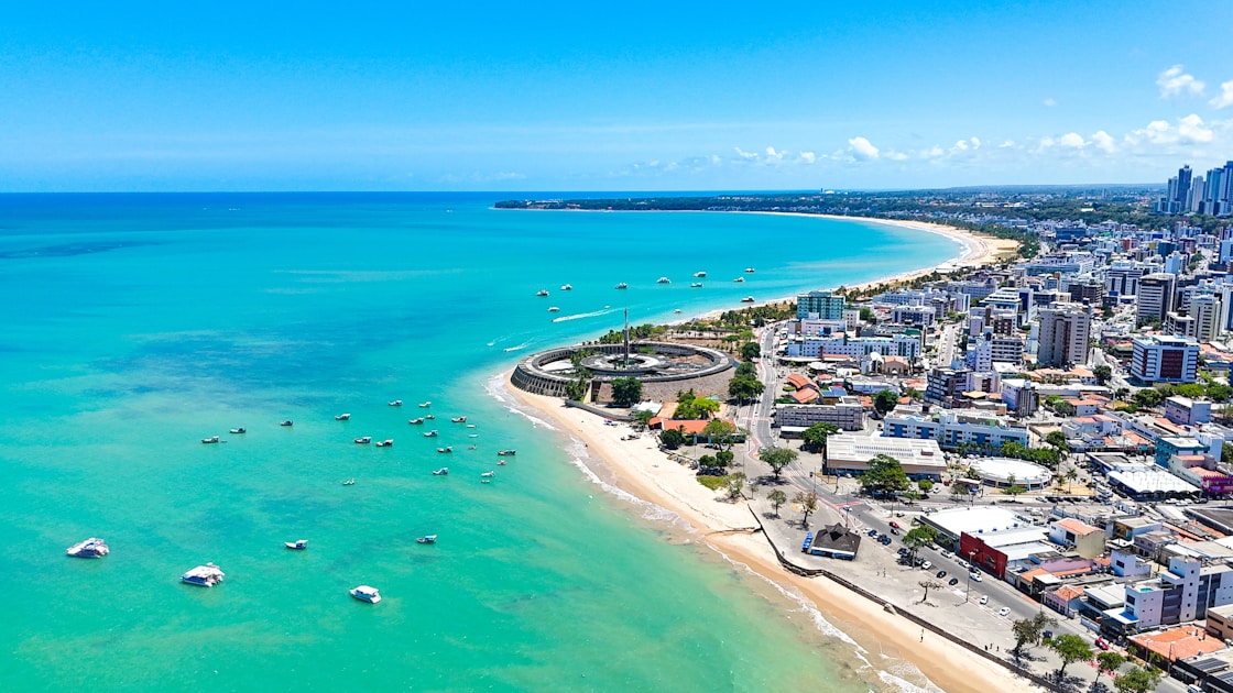An aerial view of a city and the ocean