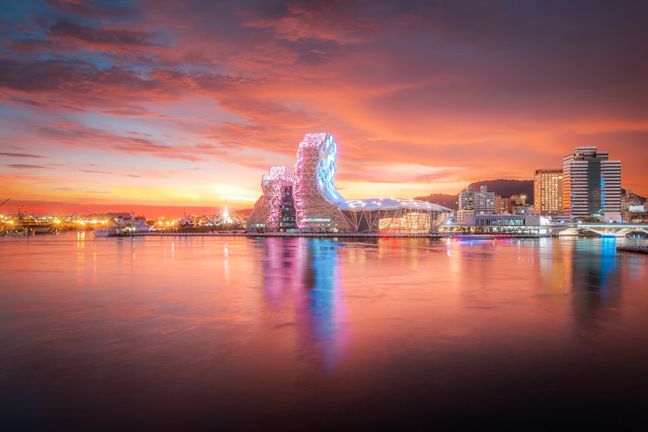 a large body of water with a city in the background