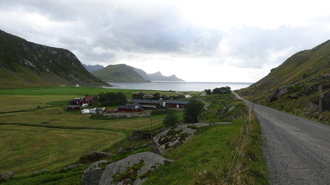 a scenic view of a small village on the side of a mountain
