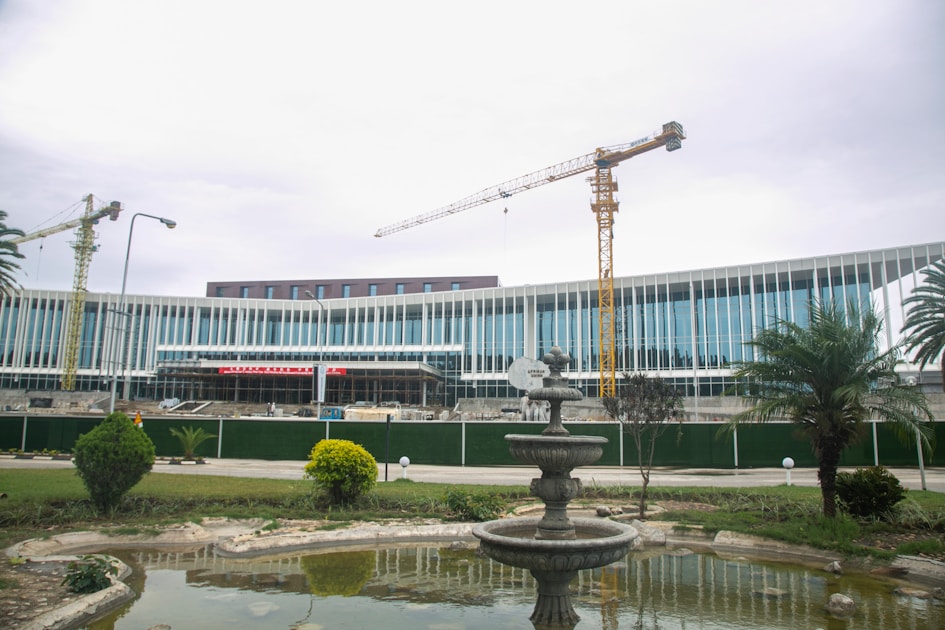 a large building with a crane on top of it