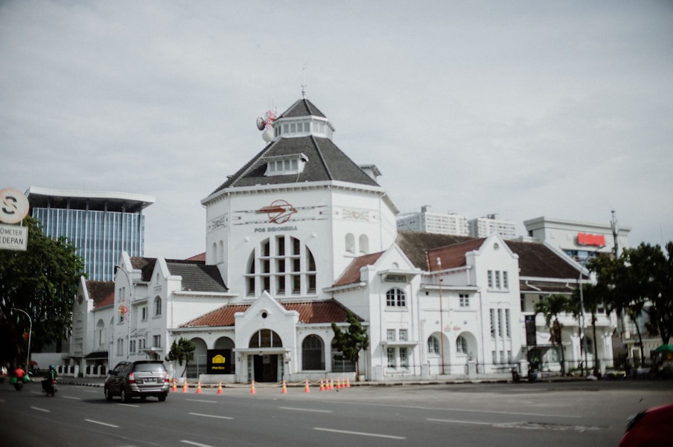 a large white building with a clock tower
