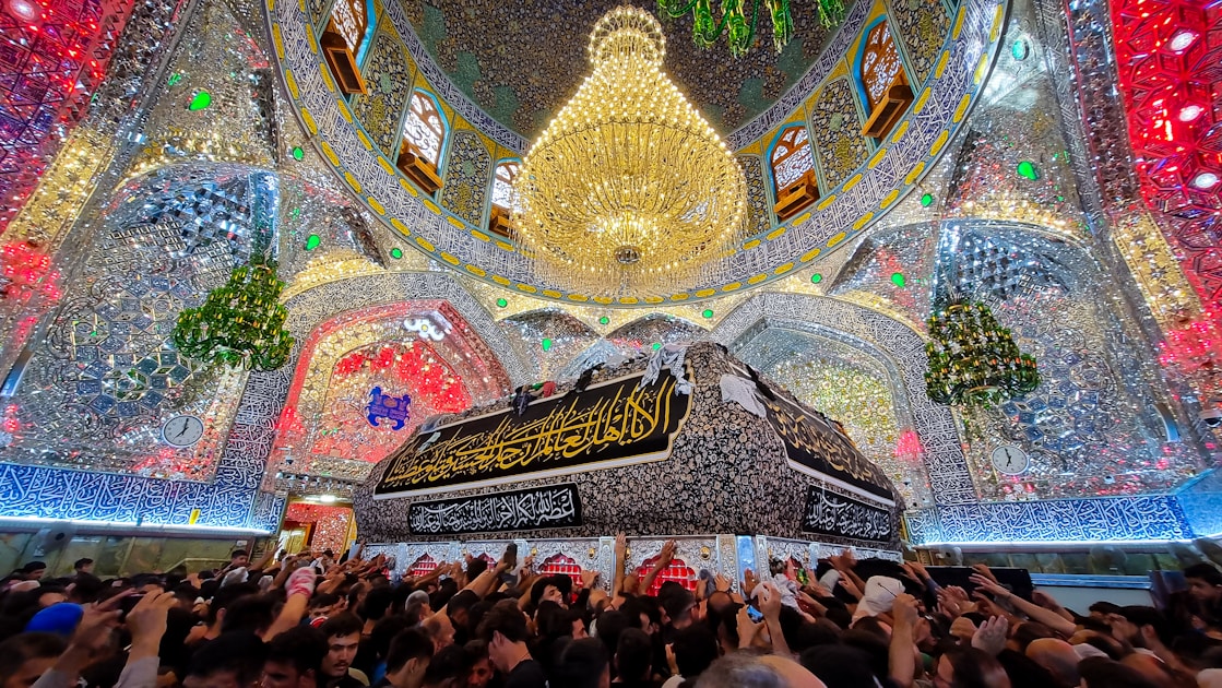 A large group of people standing in front of a building