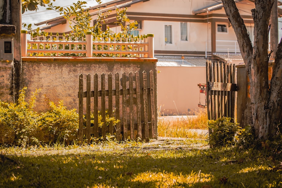 a wooden fence in front of a house