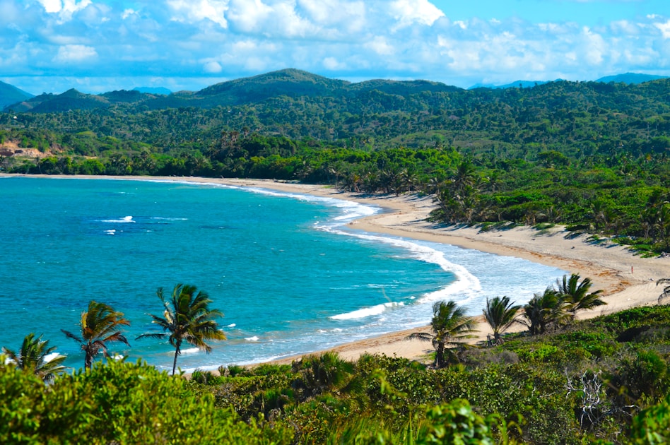A view of a beach with a boat in the water