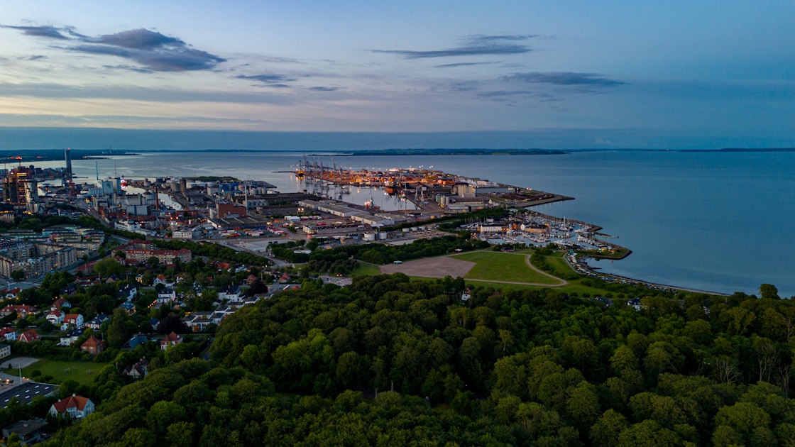 an aerial view of a city by the water