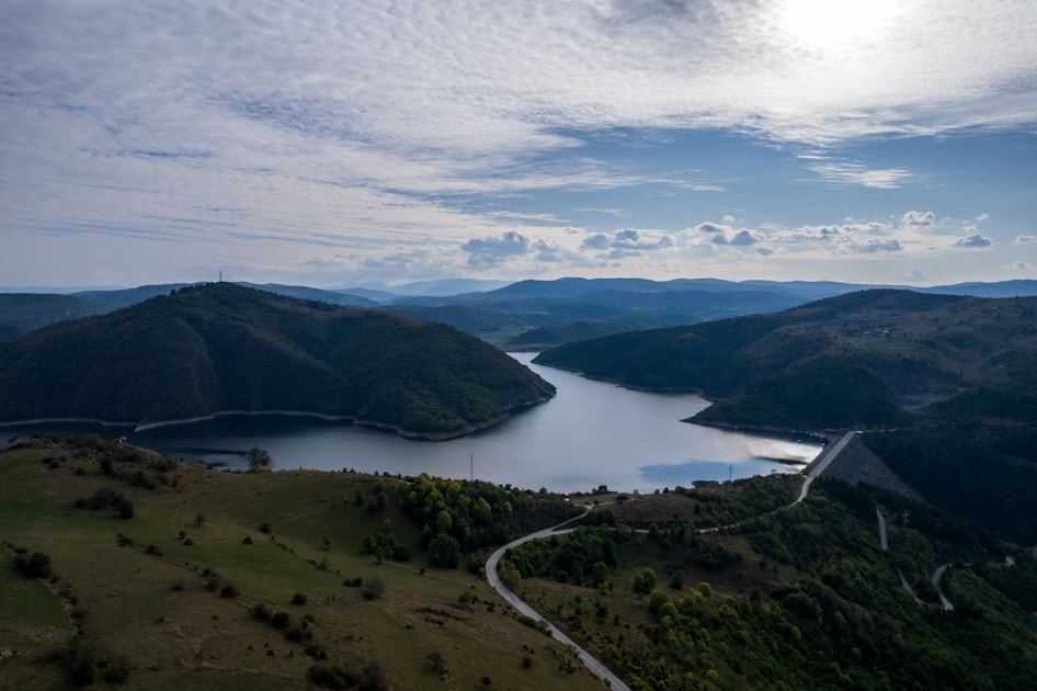 A scenic view of a lake and mountains