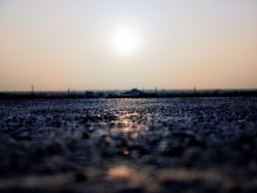 black sand under white sky during daytime