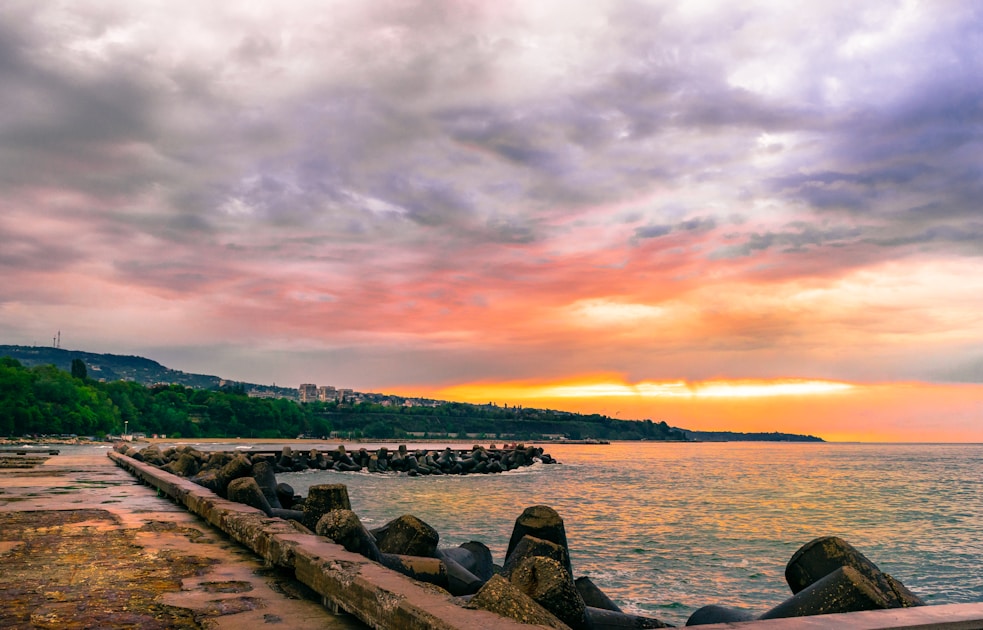 body of water under cloudy sky during daytime